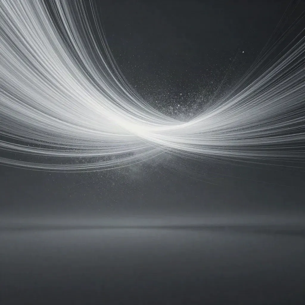 Silver filaments bloom in graphite haze with calm space for copy.